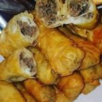 Mouthwatering Plate of Philly Cheesesteak Egg Rolls.