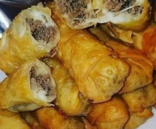 Mouthwatering Plate of Philly Cheesesteak Egg Rolls.