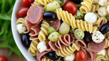 Serving the ultimate summer pasta salad on a platter.