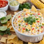 Mexican Corn Dip served with crispy tortilla chips.