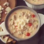 Delicious bowl of Creamy Alfredo Lasagna Soup garnished with parsley.