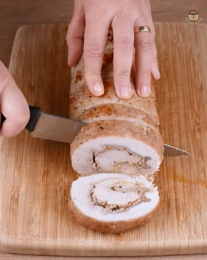 Restaurant-Style Pork Loin perfectly roasted with garlic and rosemary, showcasing a gourmet home-cooked meal high in protein.