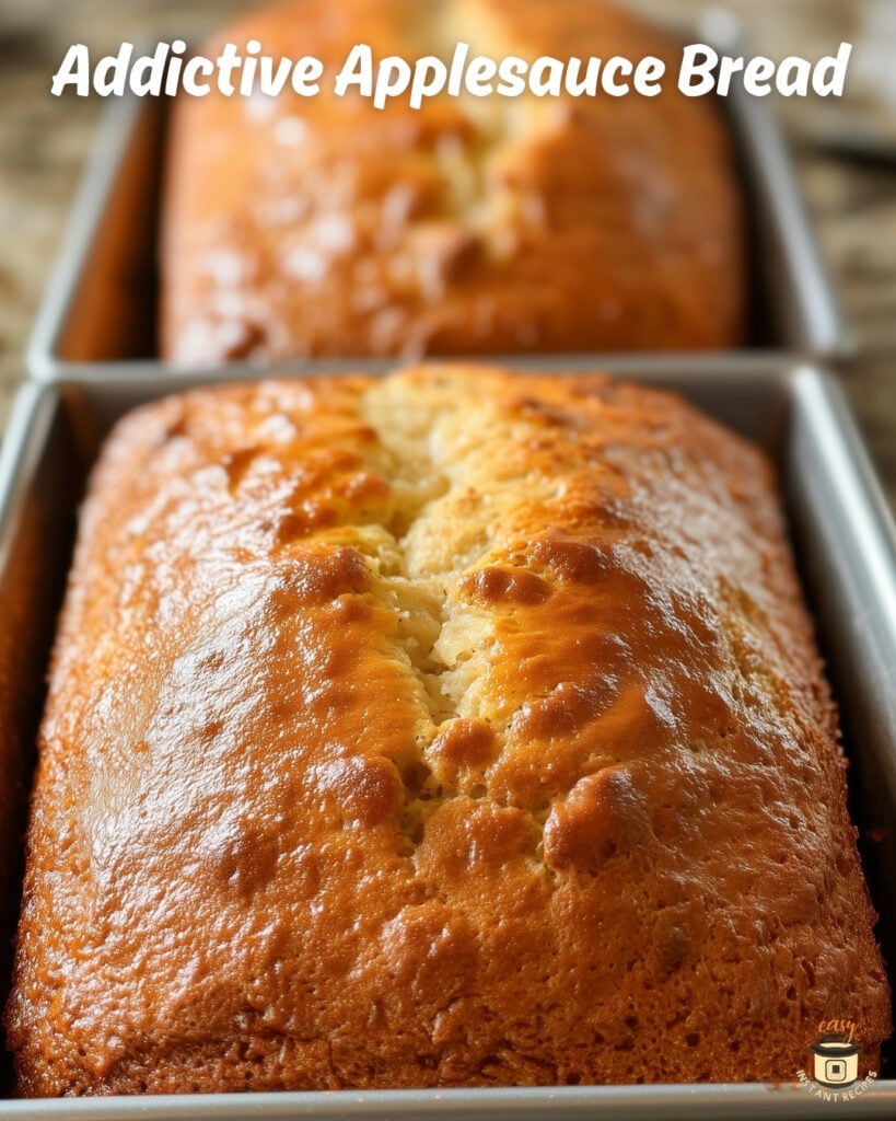 Homemade Applesauce Bread loaf cooling on a rack.